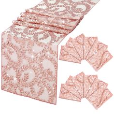 pink and white table cloths with matching napkins on each side, set against a white background