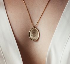 This necklace is a beautiful 14K solid gold and diamonds oval coin necklace, with a dainty heart engraving. A fine gold romantic pendant to give as a precious gift to your beloved partner. ♥ Features: ❇ Chain: ∙ 14k solid gold ∙ Gold alloy - Yellow / White / Rose Gold ∙ Length: 55 cm (21.7 inches) / 45 cm  (17.7 inches) / 42 cm (16.5 inches) ❇ Pendant: ∙ 14k solid gold ∙ Gold alloy - Yellow / White / Rose Gold ∙ Oval coin-shaped ∙ Delicate romantic heart engraving ∙ 4 grey salt-and-pepper diamon Elegant Heart Pendant Jewelry With Birth Flower Detail, Oval Recycled Gold Necklace Gift, Oval Recycled Gold Necklace For Gift, Recycled Gold Oval Necklace For Gift, Elegant Oval Pendant Jewelry With Birth Flower, Elegant Necklace With Engraving Option For Anniversary, 14k Gold Oval Birth Flower Jewelry, Elegant Heart Pendant Necklace With Birth Flower, Elegant Necklaces With Engraving Option For Anniversary Gift