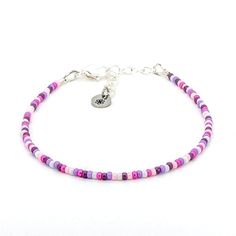 Dainty bracelet - purple Adjustable Pink Pearl Bracelet With Spacer Beads, Bohemian Pink Beaded Pearl Bracelet, Purple Beaded Chain Bracelets With Round Beads, Purple Beaded Chain Bracelet With Round Beads, Pink Pearl Bracelet With Colorful Beads, Pink Heishi Beads Necklace With Tiny Beads, Adjustable Purple Bracelet With Tiny Beads, Purple Beaded Bracelets With Tiny Beads For Beach, Adjustable Purple Bracelets With Tiny Beads