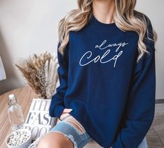 "Baby, it's cold outside. The perfect addition to your wardrobe this holiday season. This \"Always Cold\" sweatshirt will keep you warm on Thanksgiving, Christmas, or traveling. Embrace the brisk season in comfort and style! 👕Brand = Gildan Unisex Heavy Blend Sweatshirt - Classic fit - True to size - Medium-heavy fabric 🎨Color/✂️Design = - All of our shirts are printed by a professional printer using the Full Color - Direct to Garment application. We try to make all representations of color as accurate as possible, but due to the fact that monitor settings can vary, actual colors may vary slightly from what is seen on your screen. 🌿 Fiber composition = 50% cotton, 50% polyester - Made from specially spun fibers that make for a very strong, smooth fabric. Polyester fibers are extremely r Soft-washed Long Sleeve Sweatshirt For Winter, Soft-washed Cotton Sweater For Winter, Soft-washed Cotton Winter Sweater, Trendy Soft-washed Winter Sweater, Cozy Fit Soft-washed Sweatshirt For Winter, Cotton Crew Neck Top For Cold Weather, Cozy Fit Cotton Sweatshirt For Cold Weather, Cozy Cotton Sweatshirt For Cold Weather, Cotton Crew Neck Sweatshirt For Cold Weather