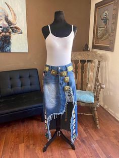 a mannequin wearing a jean skirt and white tank top in a living room