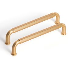 two gold handles on a white background