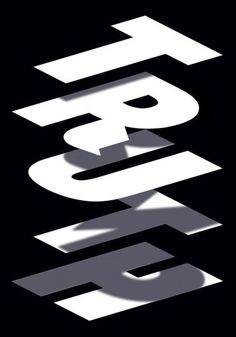 the letters are white and black on a black background with shadows coming from behind them