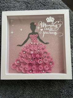 a pink dress made out of rolled flowers in a shadow box with the words mommy's little princess written on it