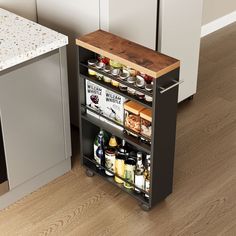 an open cabinet in the middle of a kitchen next to a counter with bottles and condiments on it