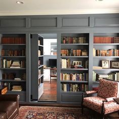 a living room filled with furniture and lots of bookshelves covered in shelves full of books