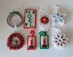 cross stitch ornaments are laid out on a table