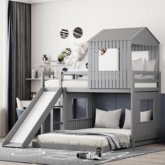 a child's bedroom with a loft bed and slide