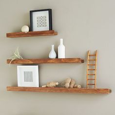 two wooden shelves with different items on them