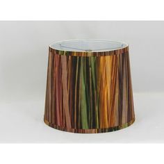 a lamp shade with multicolored stripes on it