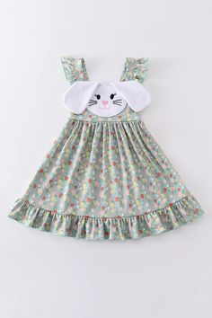 Green Easter Floral Print Bunny Applique Dresses Hop into spring in style with our Green Easter Floral Print Bunny Applique Dress! This adorable dress features a fun and playful bunny applique on a beautiful green floral print. Perfect for Easter brunch or any springtime event, this dress is sure to make a statement. (And make your little one even more egg-cited for the holiday!)  Super soft & stretchy!  Cotton/Spadex blend. 95% Cotton 5% Spandex Check out all our listings as we do combine shipping! Spring Cotton Dress With Cartoon Print, Spring Cartoon Print Cotton Dress, Sweet Spring Vacation Dress, Sweet Spring Vacation Dresses, Playful Multicolor Easter Dresses, Cotton Summer Dresses With Cartoon Print, Summer Cotton Dresses With Cartoon Print, Fun Sleeveless Spring Dress, Cute Floral Applique Dresses For Garden Party