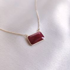 "This stunning pendant is set in 14k Solid Yellow Gold with Natural Ruby with utmost precision. It is an unique gemstone pendant for nearly every occasion and is completely hassle-free jewelry. ITEM DETAILS: * Gem: Ruby  * Gem Size: 8.5x4mm * Gem Shape: Octa Rectangle * Gem Weight: 5.28 carats * Gold Purity: 14KT * Gold Weight: 1.15 gram * Total Weight of the Pendant: 2.21 gram * Chain Length: 16\" Inches The Gold purity is guaranteed and it comes with authentic 14KT gold hallmark. Since my items are handmade, they are absolutely nickel and lead free. CUSTOMIZATION: * Gemstone customization is available and it can be substituted with a gem of your choice. Kindly message me for the same. * Chain length is customizable as well. Kindly message me for the same. PACKAGING * The Pendant comes wi Elegant Necklace With Polished Rectangular Pendant, Elegant Necklace With Rectangular Pendant And Polished Finish, Elegant Rectangular Pendant Necklace With Polished Finish, Elegant Polished Rectangular Pendant Necklace, Fine Jewelry Ruby Gift, Fine Jewelry Polished Rectangular Pendant Necklace, Elegant Rectangular Gemstone Pendant Jewelry, Fine Jewelry Necklace With Rectangular Pendant And Polished Finish, Fine Jewelry Necklaces With Polished Rectangular Pendant