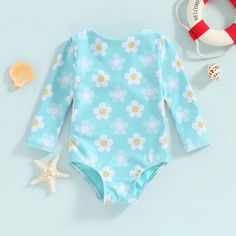 Get your little one ready for a splash of fun this summer with our DAPHNE Flower Swimsuit! Designed for baby girls, this swimsuit features long sleeves and a playful floral print. Keep your little flower protected from the sun while looking stylish. (Sunscreen not included!) Long Sleeve Swimwear With Upf 50+ For Play, Playful Swimwear With Upf 50+ For Spring, Playful Swimwear With Upf 50+, Long Sleeve Swimwear With Upf 50+ For Spring, Playful Upf 50+ Swimwear For Spring, Long Sleeve Upf 50+ Swimwear For Spring, Uv Protection Swimwear For Spring Playwear, Long Sleeve Swimwear For Spring Pool Season, Cute Swimwear With Uv Protection For Poolside