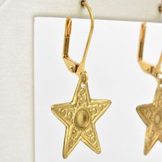 Earrings measure about 1.5" long Gold plated lever-backs Brass earrings Handmade in the USA Handmade in Salem, Massachusetts by WE DREAM IN COLOUR Goldmakers Jewelry Mission Statement Goldmakers Jewelry creates and curates a comprehensive selection of artfully designed hand-crafted jewelry. We aspire to offer the jewelry enthusiast access to affordable classics as well as fresh innovative designs. Symbolic Star Shaped Earrings For Gift, Nickel-free Star Shaped Symbolic Earrings, Symbolic Nickel-free Star Earrings, Symbolic Star-shaped Nickel-free Earrings, Nickel-free Star-shaped Earrings For Jewelry Making, Brass Star-shaped Jewelry Gift, Star-shaped Earrings With Lever Back For Gifts, Star Shaped Nickel Free Plug Earrings For Gift, Star-shaped Nickel-free Plug Earrings As Gift