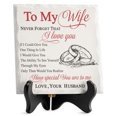 a sign that says to my wife i love you with two intertwined rings on it