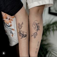 two people with matching tattoos on their legs, one has a fish and the other has a bird