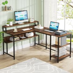 a computer desk with two computers on it