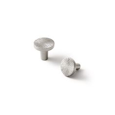 two white knobs on a white background