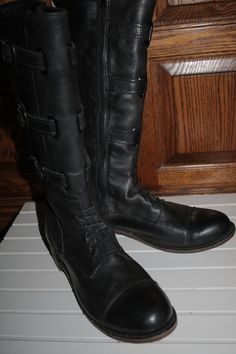 "Vintage is the brand name of these fantastic old replica style equestrian boots. These boots have a mock lace up at the ankle. Made in the USA quality leather though out the upper. Vintage awesomeness at it's finest. These are some pretty sweet old fashioned boots. Brand new and never been worn outside before. These boots are ready to become a part of a newer adventure so why not make them yours today? These are tall knee height and have a instep zipper that allows you to easily slip these on q Fitted Moto Boots With Round Toe For Riding, Fitted Moto Boots For Riding With Round Toe, Vintage Riding Boots For Fall, Fitted Moto Boots For Riding In Fall, Vintage Black Boots, Equestrian Boots, Frye Boots, Vintage Branding, Equestrian Style