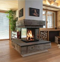 a living room filled with furniture and a fire place