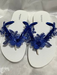 These beautiful flip flops are wrapped in a royal blue satin ribbon, and adorned with an Royal blue lace flower with sequins. Ribbon color is royal blue if you are needing other colors of ribbon or decoration please contact me and will be happy to accommodate you! All flip flops are handmade to order and the production time 5 to 10 days and then please allow additional time for shipping. Amazing for beach, weddings, flower girl or a fancy event, you choose! Please choose your size from the drop Adjustable Flip Flops For Summer Party, Adjustable Open Toe Flip Flops For Party, Blue Summer Party Flip Flops, Blue Wedding Sandals, Blue Lace Flower, Bridal Flip Flops, Fancy Event, Wedding Flip Flops, White Flip Flops