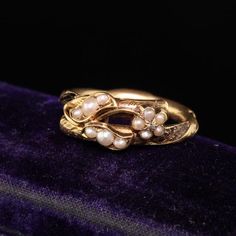 Beautiful Antique Victorian 18K Yellow Gold Seed Pearl Mourning Ring. This incredible ring is in good condition but is missing the hair that lines the inside of the ring. Some remnants of the hair are still there and the ring is in good condition overall. The inside of the ring is engraved but all the letters we can make out are "Mary" and "Nov 25th 1856" "51 Years". It is truly a piece of history and incredible design.Item #R0744Metal: 18K Yellow GoldSize: 6Weight: 2.6 GramsMeasurements: 8.2 mm Victorian Antique Ring, Heirloom Jeweled Wedding Bracelets, Heirloom 14k Gold Wedding Bracelet, Heirloom Jeweled Bracelets For Wedding, Heirloom 14k Stamped Jewelry Bangle, Heirloom Wedding Bracelet Stamped 14k, Elegant Hallmarked Bangle For Formal Events, Antique 14k Gold Bangle For Anniversary, Vintage 14k Stamped Bangle For Weddings