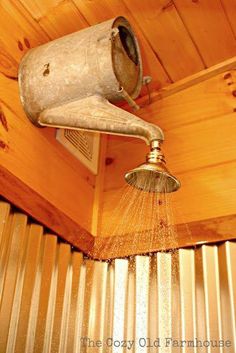 an old fashioned shower head is sprinkled with water