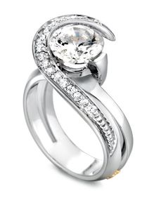 a white gold ring with diamonds on the sides and a center stone in the middle