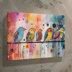 three colorful birds perched on a branch with dots and circles in the sky above them