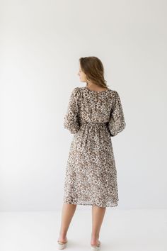 A favorite that has been brought back in a new print with long sleeves, the 'Ramona' now features a beautiful floral design that has endless styling possibilities. Pair with low heels and a clutch for a charming fall wedding guest look! Exclusively designed by us with you in mind. 100% Polyester Lined Waist Down Hand Wash Cold Hang or Lay Flat to Dry Do Not Bleach Iron Low Heat If Needed Do Not Dry Clean Maternity/Bump Friendly! Model Height 5'7" | Wearing Size Small Model Height 5'8" | Wearing Fall Floral Midi Dress For Day Out, Modest Floral Print Dress For Fall, Fall Floral Print Midi Dress, Beige Printed Fall Dress, Chic Ditsy Floral Print Dress For Fall, Printed Midi Length Floral Dress For Fall, Modest Brown Midi Dress For Spring, Fall Cream Midi Dress For A Day Out, Brown Floral Print Midi Dress For Brunch