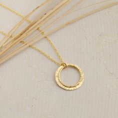 This beautiful Textured Gold Circle Necklace is handcrafted for you with great care. Hand-hammered 14K Gold-filled rings make each necklace one of a kind. The necklace is classic, comfortable and the perfect earring for every day. It looks pretty on its own and when layered with another necklace. You can also add a beautiful pair of matching earrings. MATERIALS AND SIZE ◆ Metals - 14K Gold Filled  ◆ The pendant measures approx. 20 mm / 0.79 inches in length  ◆ NECKLACE LENGTH = the total circumf Open Circle Necklace, Gold Circle Necklace, Pendant Necklace Gold, Length Necklace, Gold Circle, Gold Filled Ring, French Wire, Circle Necklace, Gold Texture