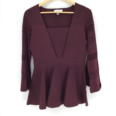 Carven Burgundy Bell Sleeve Peplum Top Women's Size Medium Condition: New With Tags Material: 57% Viscose, 40% Nylon, Chic Cut-Outs Inserts Feminine Silhouette Bell-Sleeve Top Squareneck Three-Quarter Bell Sleeves Peplum Hem Pull-On Style Color: Burgundy Retail Price: $490 + Tax Measurements Available Upon Request No Trades/Holds Offers Welcome! Elegant Peplum Blouse For Fall, Fall Elegant V-neck Peplum Top, Fitted V-neck Peplum Top For Fall, Elegant Fall V-neck Peplum Top, Elegant V-neck Peplum Top For Fall, Elegant Fitted Long Sleeve Peplum Top, Chic Fitted Burgundy Blouse, Fitted Burgundy Blouse For Work, Peplum Crop Top