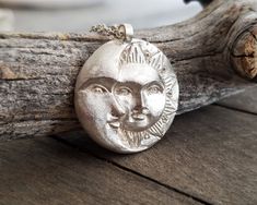 This celestial sun and moon pendant necklace is made by using the ancient lost wax technique and it is hand forged. It comes in a sterling silver chain of your choice or a waxed cord and the pendant is 23gr solid sterling silver made in great detail. A unique, ethereal piece of jewelry that will add character to any look and is ideal as a gift to yourself or to someone special. The total length of the chain is 460mm, please contact me if you would like me to custom made the length of your chain. Celestial Sun And Moon Sterling Silver Necklace, Celestial Sterling Silver Necklace With Sun Design, Silver Celestial Necklace With Sun Design, Sterling Silver Necklace With Sun Design, Hand Forged Sterling Silver Celestial Necklace, Flat Engagement Rings, Necklace Sun And Moon, Sun And Moon Pendant, Red Crystal Ring