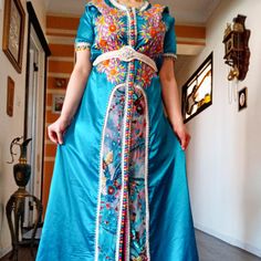 stunning Moroccan dress this authentic royal Moroccan dress is very comfortable and elegant and will turn heads at any occasion. Measurements : bust:112cm/44'' length:153cm/60'' used in a very good condition it would fit M and L as it's adjustable with the belt Bohemian Gown For Ceremonial Eid, Bohemian Ceremonial Gown For Eid, Bohemian Gown For Eid Ceremonial, Traditional Long Dress Kaftan For Weddings, Traditional Wedding Kaftan Long Dress, Bohemian Embroidered Ceremonial Gown, Traditional Long Wedding Kaftan, Traditional Wedding Kaftan, Bohemian Floor-length Kaftan For Traditional Ceremonies