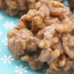 some kind of granola on a blue and white tablecloth with snowflakes