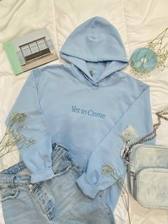 "A plush comfortable light blue embroidered hoodie celebrating the album of South Korean group BTS. Front pocket with fresh and simple \"Yet to Come\" embroidered design. This hoodie gives a subtle design for everyday wear, showing off your love for Bangtan and looking stylish. ~Sweatshirt is 50% cotton, 50% Polyester ~Made to be pill-resistant ~Made with 50% sustainability-grown cotton. ~Double needle stitching throughout. ~1x1 ribbed collar, cuffs, and waistband with spandex WANT BIGGER THAN 3X? Message for special order." Cotton Kpop Hoodie, Light Blue Cotton Hoodie, Light Blue Crew Neck Cotton Hoodie, Light Blue Cotton Hooded Hoodie, Light Blue Cotton Hoodie For Winter, Winter Cotton Hoodie In Light Blue, Light Blue Hoodie For Streetwear In Spring, Light Blue Hoodie Sweatshirt For Spring, Light Blue Crew Neck Hoodie For Spring