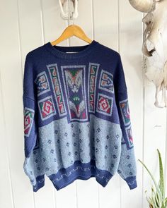 "Vintage 90's Brian MacNeil Knitwear Dad Sweater. Size Large Blue Men's Geometric Design Blue Sweater. 15% Wool 85% Acrylic. Some pilling. Length: 28\" Underarm to underarm: 25\".  Check out the rest of our shop: https://instagram.com/hollyshopvintage?igshid=OGQ5ZDc2ODk2ZA== https://hollyshopvintage.etsy.com/ Orders over $35 ship for free. Please check out my Instagram for my newest finds: Hollyshopvintage  Everything priced over $35 has shipping already included in the total price. I'll gladly combine shipping on multiple items to save you money, when it is safe to do so! Message me to make adjustments ahead of time, or make your purchase and I'll refund the shipping overages.  Most items are Vintage. Expect some vintage wear. Items may contain unmentioned flaws.  I only post items that h Casual Blue Sweater With Fair Isle Pattern, Casual Blue Fair Isle Sweater, Blue Jacquard Knit Sweater For Fall, Blue Jacquard Knit Sweater, Blue Jacquard Knit Crew Neck Sweater, Retro Blue Knitted Sweater, Retro Blue Long Sleeve Sweater, Blue Long Sleeve Retro Sweater, Blue Fair Isle Pattern Winter Sweater