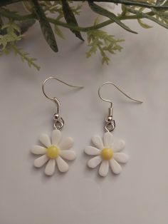 Stay down to earth with handmade floral beaded jewelry, Choose the natural look with cool shades and daisy patterns. - Have some fun in the sun with these new novelty jewelry styled as your favorite life art! - Unique earrings perfect for any season or dressing up at any occasion.  - New year pattern, handmade with love in USA - High quality stainless steel hooks and plastic daisy charms. - Size: 35mmx17mm. - Stylish to wear and make an ideal gift for Mom, sister, friends, family... - Free shipp White Daisy-shaped Jewelry For Spring, White Daisy-shaped Spring Jewelry, Handmade Flower-shaped Earrings For Spring, Handmade Spring Flower-shaped Earrings, Summer Flower Charm Earrings, Cute White Beaded Dangle Earrings, Handmade Flower Drop Earrings For Summer, Handmade Flower Earrings For Summer, Trendy White Earrings With Flower Charm