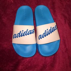 Nwot Blue And White Adidas Size 6 Slides Adidas Blue Sandals For Spring, Spring Blue Adidas Sandals, Adidas Blue Slip-on Sandals, Sporty Blue Sneakers For Beach, Sporty Blue Sneakers For The Beach, Blue Adidas Slip-on Sneakers, Adidas Blue Synthetic Sandals, Adidas Blue Open Toe Sandals, Spring Blue Adidas Sneakers