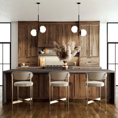 a kitchen with wooden cabinets and marble counter tops, along with four chairs that sit at the center island