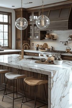 a kitchen with marble counter tops and stools