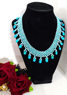 A handmade glass beaded necklace that is perfect for any occasion: parties, weddings, holidays, birthdays, anniversaries. All products are hand-crafted by my mother. Dimensions: - Length: 15.6 cm - Width: 14.5 cm - Height: 2.0 cm Lightweight, high quality with a hook as a clasp. Will respond to concerns and suggestions promptly. Shipping costs: Free Domestic Shipping. All orders are sent by air-mail with tracking number. Time of delivery: Estimated 2-5 days for domestic shipping; international may take 7-14 days. Feel free to check out our other similiar products! Link: https://www.etsy.com/shop/NurKnitsNKrafts Turquoise Faceted Beads Necklaces For Party, Turquoise Round Beads Necklace For Wedding, Turquoise Necklace With Large Beads For Party, Party Turquoise Beaded Necklaces With Faceted Beads, Traditional Blue Beaded Necklaces For Party, Turquoise Necklaces With Round Beads For Wedding, Party Turquoise Faceted Beaded Necklaces, Turquoise Beaded Necklaces With Round Beads For Weddings, Turquoise Beaded Necklaces For Wedding With Round Beads