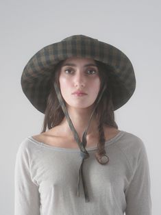 The Garden Hat is made from deadstock gingham check. This packable hat is great for travel, gardening, the beach - or anywhere where you need protection from the elements. Features grommets for ventilation, and the tie strap is removable and adjustable. Newly redesigned shape - the brim is slightly shorter than previous seasons. Garden Hat, Brown Gingham, Gardening Hat, Packable Hat, Wide Brim Sun Hat, End Of Season Sale, Gingham Check, Sun Hat, Wide Brimmed