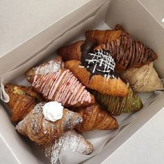 a box filled with different types of pastries