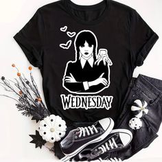 Wednesday Addams Halloween T-Shirt Unisex Unisex T-Shirt Customized This Preshrunk 100% Cotton Tee Brand: Gildan Adult Size Most 100% Cotton Preshrunk Machine Wash Cold With Like *** Let Me Know Your Size Before Purchase ** Or Will Be Shipped In The Size That Is Posting Available Sizes: Small/ Medium/ Large/ Extralarge/ 2xl/ 3xl Measurements Are Shown In Pictures! You Can Ask For Other Sizes Or Colors Before Purchase! I Can Customize Special Orders By Request, Remember The Price Depends On The D Black Graphic T-shirt For Fall, Black Punk T-shirt With Character Print, Black Punk T-shirt For Fall, Halloween Black T-shirt With Character Print, Black Spooky Crew Neck Top, Black Graphic Tee With Funny Print, Black Crew Neck T-shirt With Pop Culture Style, Black Graphic Design T-shirt For Fall, Spooky Graphic Print T-shirt For Fans