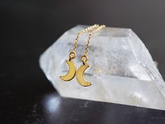 These sweet crescent moons will glint and glitter by the light of the sun or the moon. Threader earrings are a perfect choice for those who easily lose earrings due to stretched earring holes (or those who want a little extra sway in their step). - gold plated crescent moon pendants - gold fill threader earrings - nickel free and hypoallergenic - ready to ship within 1-3 days of purchase Let's keep in touch! Instagram, @thebealine facebook.com/thebealine Please see my policies page for more info Adjustable Half Moon Earrings As Gift, Half Moon Earrings For Pierced Ears As Gift, Crescent Moon Charm Earrings As Gift, Dainty Half Moon Earrings With Moon Charm, Minimalist Moon Phase Earrings As Gift, Celestial Moon Charm Earrings As Gift, Dainty Half Moon Charm Earrings, Dainty Gold Earrings With Moon Phase, Dainty Moon Phase Earrings As Gift