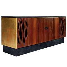 an art deco sideboard made out of wood and metal