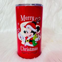 a red christmas tumbler with mickey mouse on it