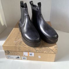 Brand New Carmel Chelsea Boot Color Black Burnished Size 38 Leather Slip-on Boots With Round Toe, Slip-on Leather Boots With Round Toe, Fall Slip-on Boots With Contrast Sole, Slip-on Boots With Contrast Sole For Fall, Leather Boots With Contrast Sole And Medium Width, Black Leather Slip-on Boots, Modern Slip-on Boots With Contrast Sole, Slip-on Boots With Rubber Sole And Closed Toe, Slip-on Rubber Sole Boots With Closed Toe