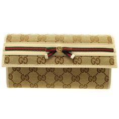 Gucci Sherry Line 256998 GG Canvas Leather Beige Bifold Long Wallet 5H0074GUCCIBrand: GucciGender: WomenModel: 256998Country of Origin: ItalyColor: BeigeMaterial: GG canvasSize (HxWxD): 10.5cm x 19cm x 1.5cm / 4.13'' x 7.48'' x 0.59'' Italy Design, Gucci Models, Luxe Fashion, Vuitton Bag, Long Wallet, Canvas Leather, Wallet Case, Canvas Size, Fashion Bags